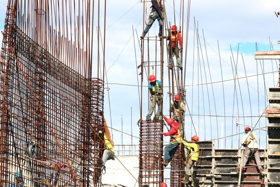 people working on building during daytime